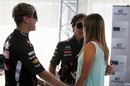 Sebastian Vettel and Christian Horner take part in a blindfold round during a sponsors' quiz in the paddock on Thursday
