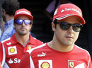 Fernando Alonso follows Felipe Massa in the paddock