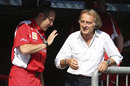 Stefano Domenicali and Luca di Montezemolo enjoy a relaxed chat on the Ferrari pit wall