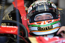 Jerome d'Ambrosio adjusts his helmet in the Lotus garage