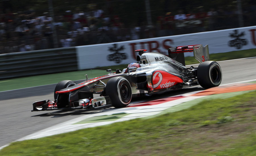 Jenson Button clips an apex on medium tyres