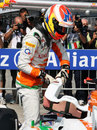 Paul di Resta climbs out of his car after qualifying 