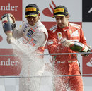 Lewis Hamilton and Fernando Alonso celebrate on the podium