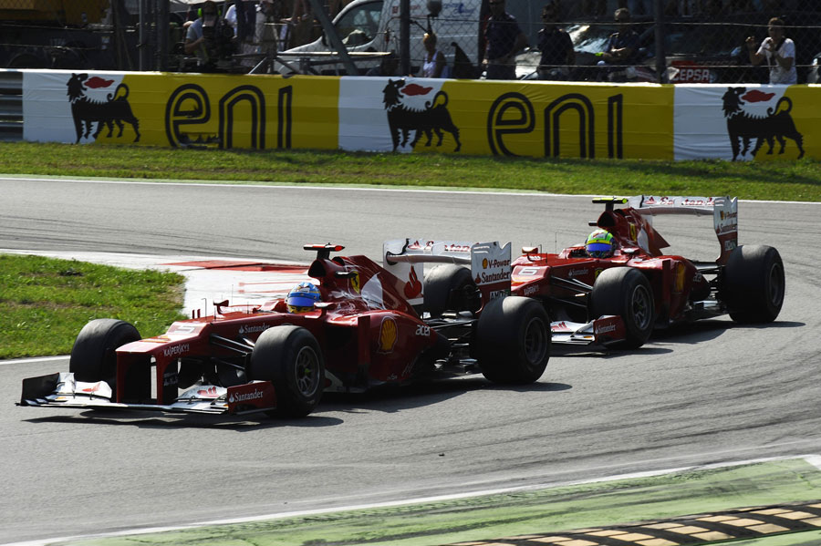 Fernando Alonso leads Felipe Massa on track
