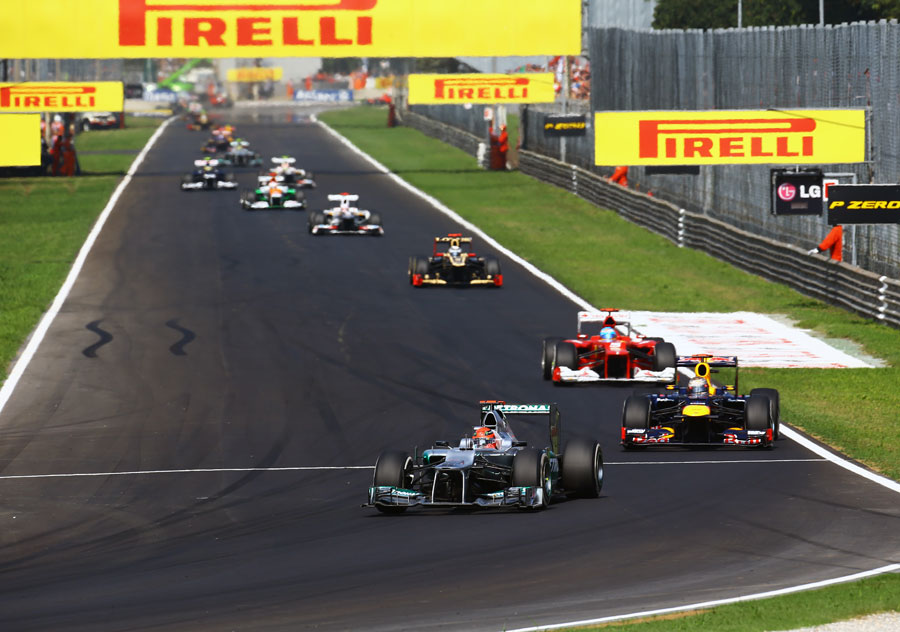 Michael Schumacher leads a queue of cars early in the race