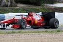 Felipe Massa's Ferrari is towed back to the pits