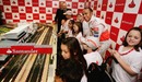 Lewis Hamilton enjoys a Scalextric race with children from Great Ormond Street Hospital