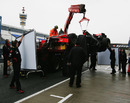 The Virgin of Timo Glock is returned to the pits