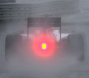 Rubens Barrichello heads out on the rain-drenched circuit