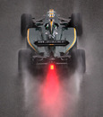 Heikki Kovalainen's Lotus trundles down the pit lane
