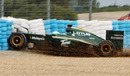 Heikki Kovalainen crashes into the tyre barrier