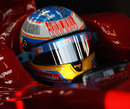 Fernando Alonso noses his Ferrari out of the garage