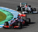 Jenson Button lead Michael Schumacher at Jerez