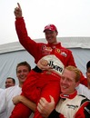 Michael Schumacher celebrates his sixth world title