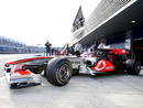 Jenson Button leaves his garage in the McLaren