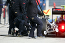 The Toro Rosso mechanics complete a pit stop