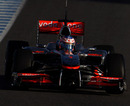 Jenson Button positions his car on corner entry