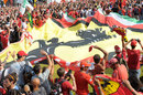 Ferrari supporters celebrate Fernando Alonso's podium finish