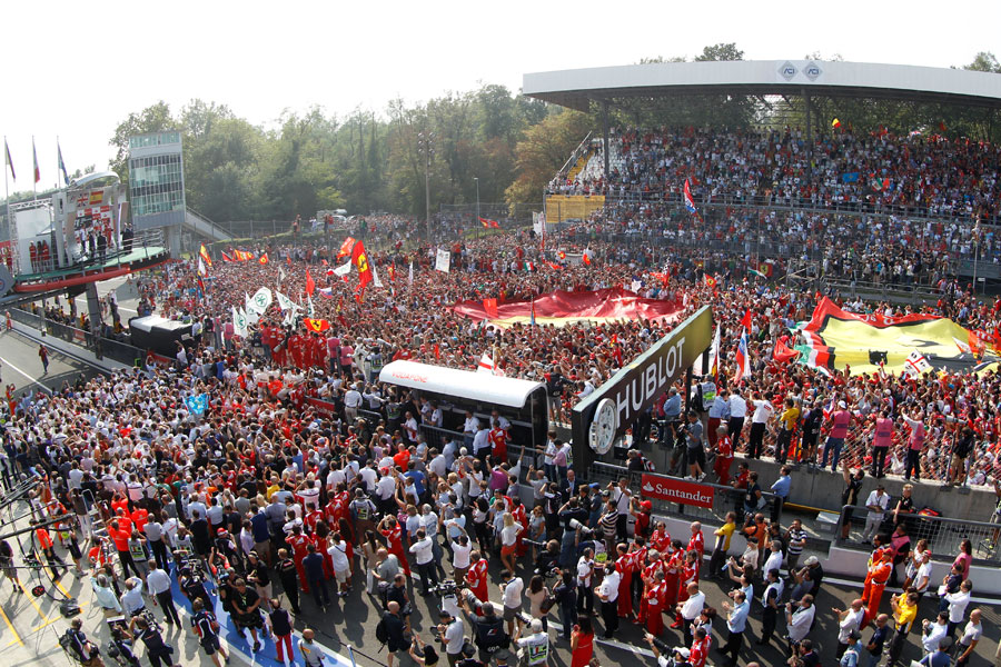 Fans flood the track for the podium presentations