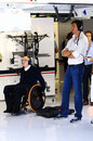 Sir Frank Williams and Toto Wolff watch on from the Williams garage