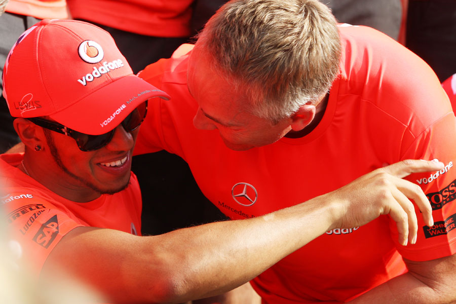 Lewis Hamilton and Martin Whitmarsh ahead of the post-race victory photo