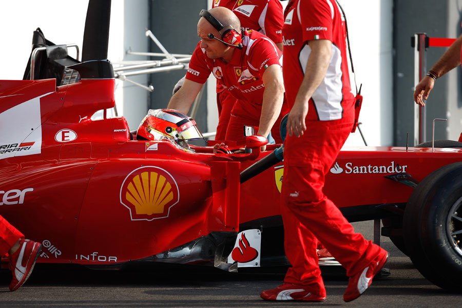 Jules Bianchi is wheeled in to the Ferrari garage