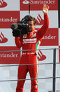 Fernando Alonso plays cameraman on the podium