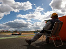 A marshal watches on as Jules Bianchi racks up the laps for Force India