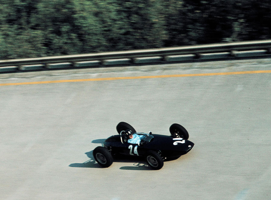 Graham Hill tackles the banking in his BRM