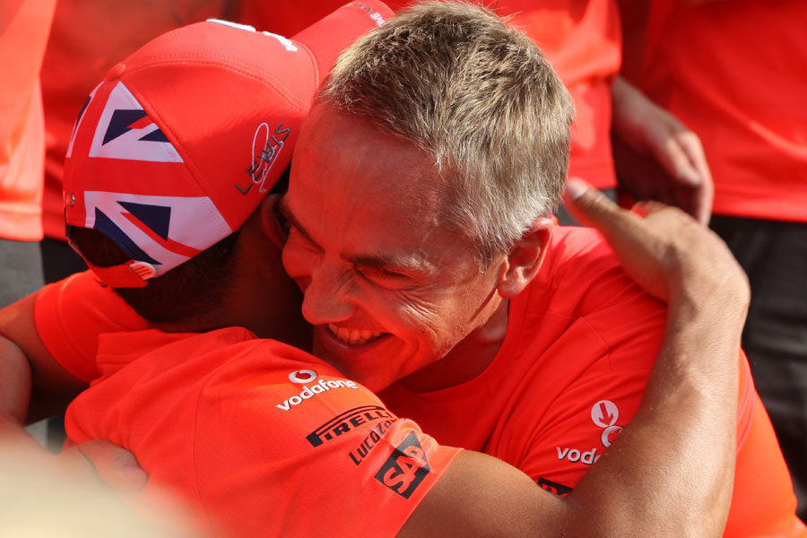 Lewis Hamilton and Martin Whitmarsh ahead of the post-race victory photo