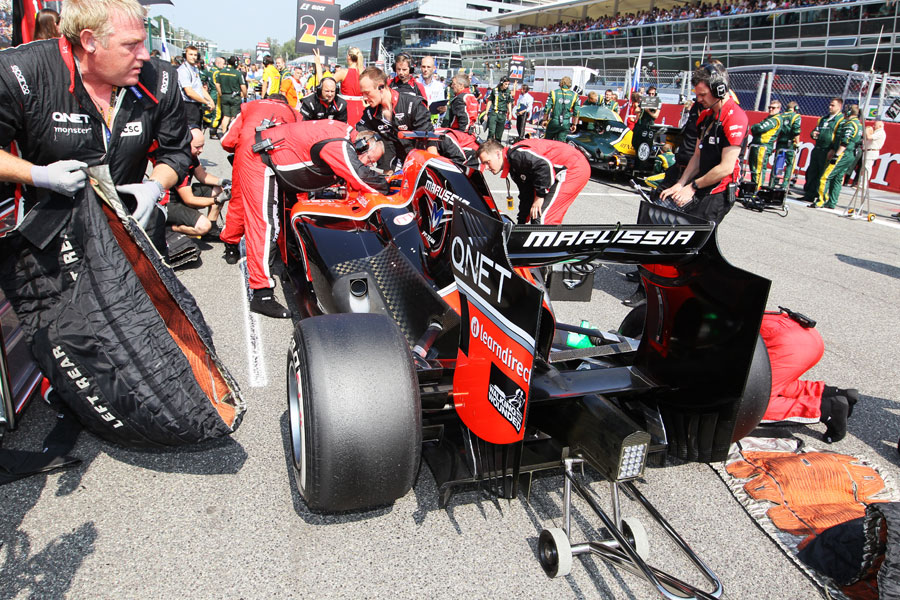 Marussia prepares Timo Glock's car on the grid