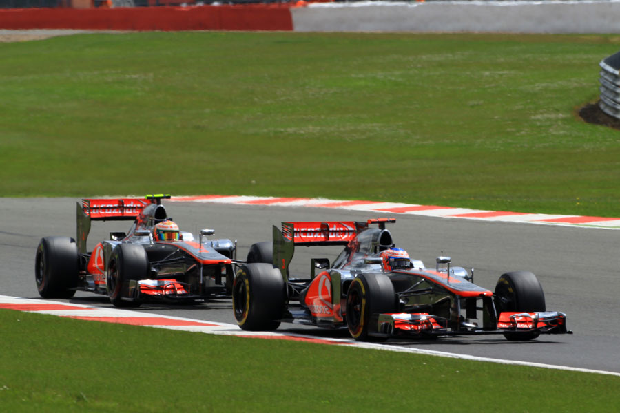 Jenson Button leads Lewis Hamilton on track