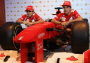 Felipe Massa and Fernando Alonso pose with a Lego Ferrari at a media event