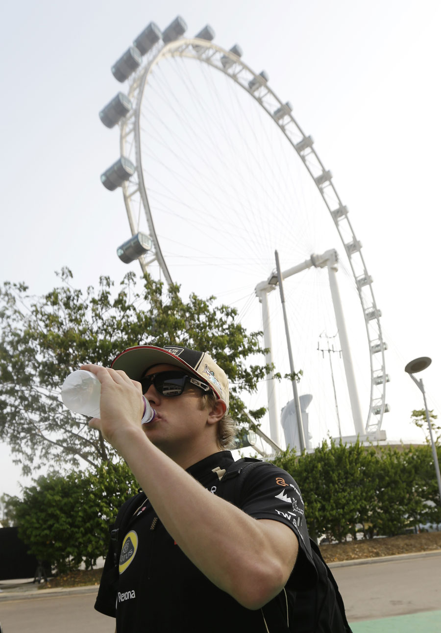 Kimi Raikkonen arrives in the paddock on Thursday