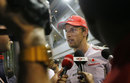 Jenson Button faces questions from the media