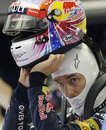 Mark Webber sporting a new helmet design in the Red Bull garage