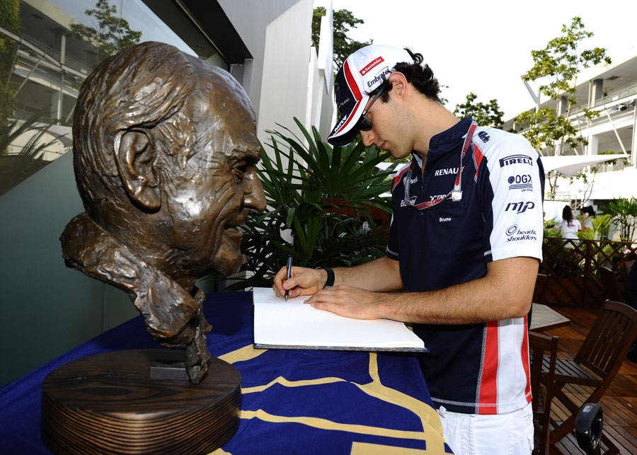 Bruno Senna signs a book of condolence for the late Sid Watkins