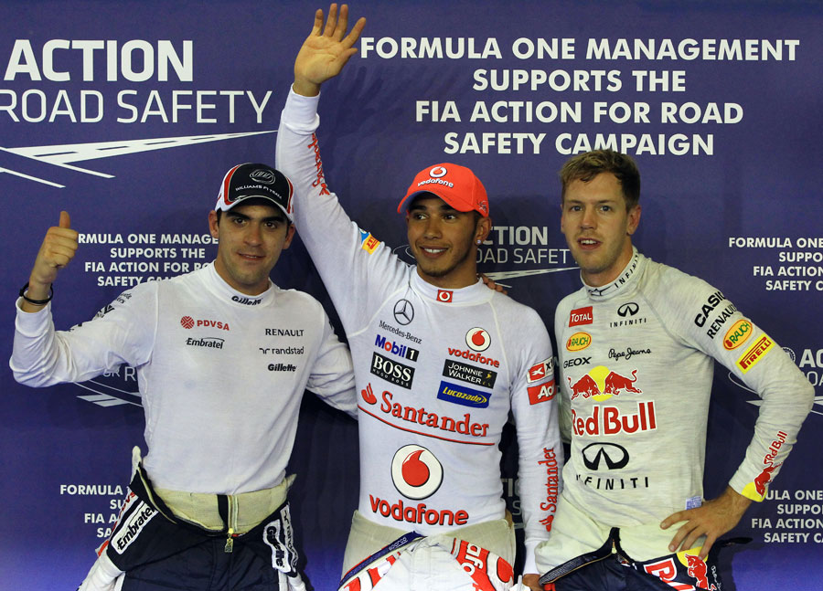 The top three drivers celebrate after qualifying