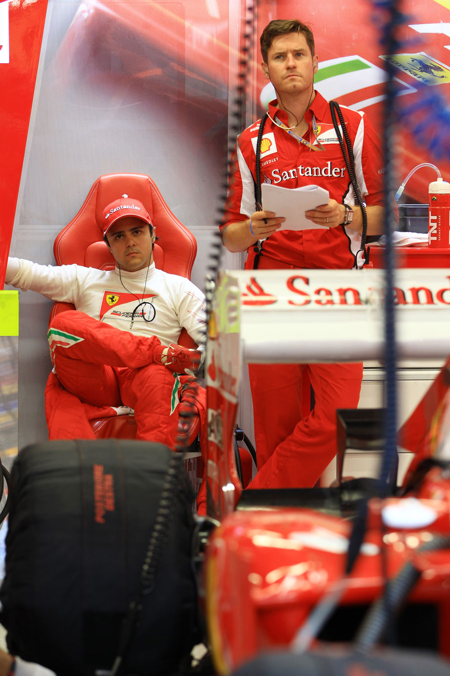 Felipe Massa and his race engineer Rob Smedley look concerned in the Ferrari garage