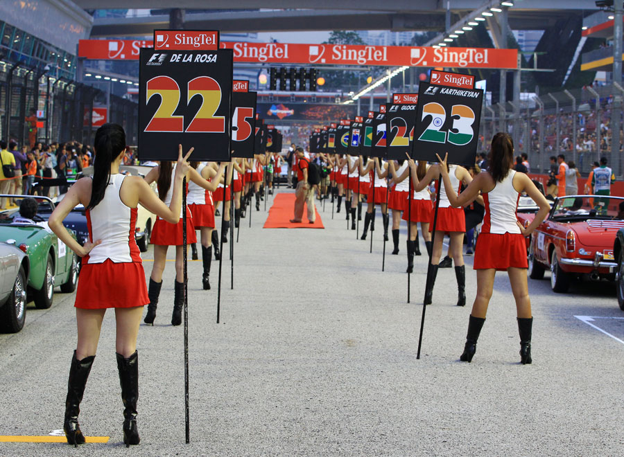 Grid girls line up for the drivers' parade