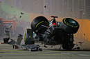 Michael Schumacher crashes out of the race after making contact with Jean-Eric Vergne
