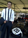 ESPNF1 assistant editor Chris Medland poses for a photo with Stirling Moss's Lotus 18