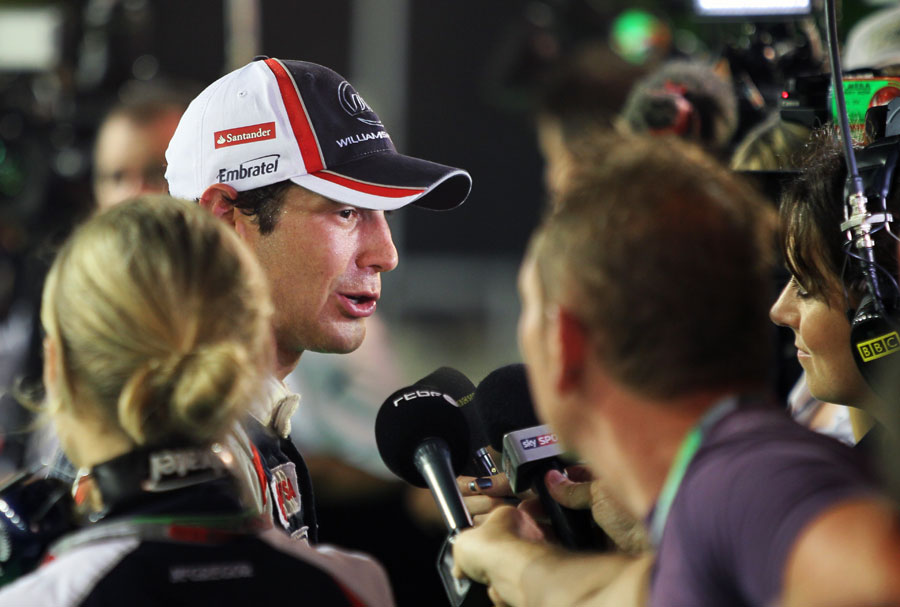 Bruno Senna talks to the media after retiring on the final lap