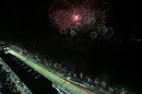 Fireworks explode over the circuit after the race