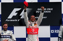 Lewis Hamilton celebrates his maiden grand prix victory