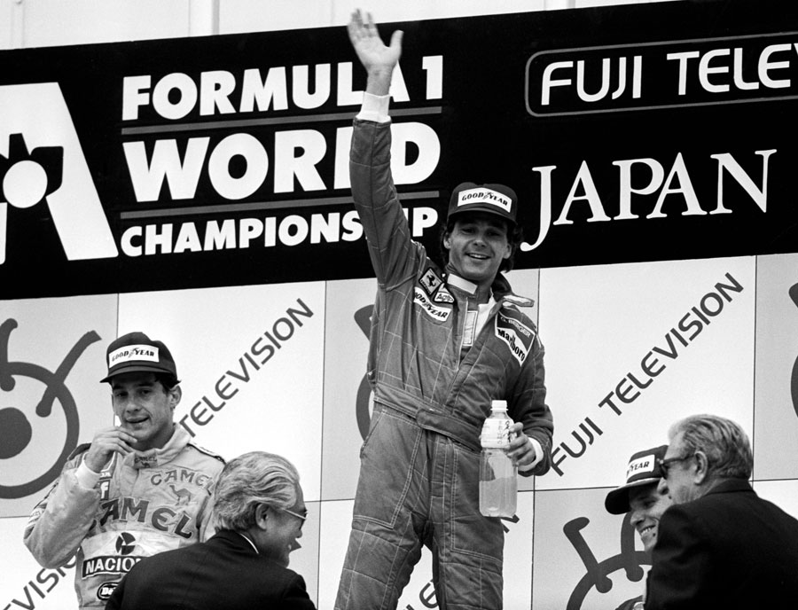 Gerhard Berger celebrates on the podium