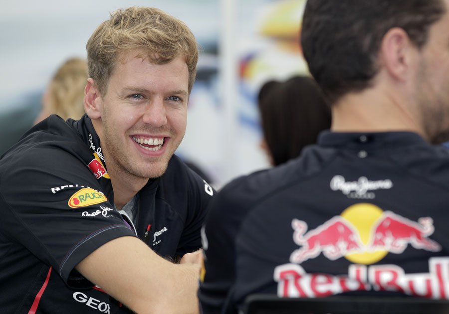 Sebastian Vettel enjoys a joke in the Red Bull Energy Centre