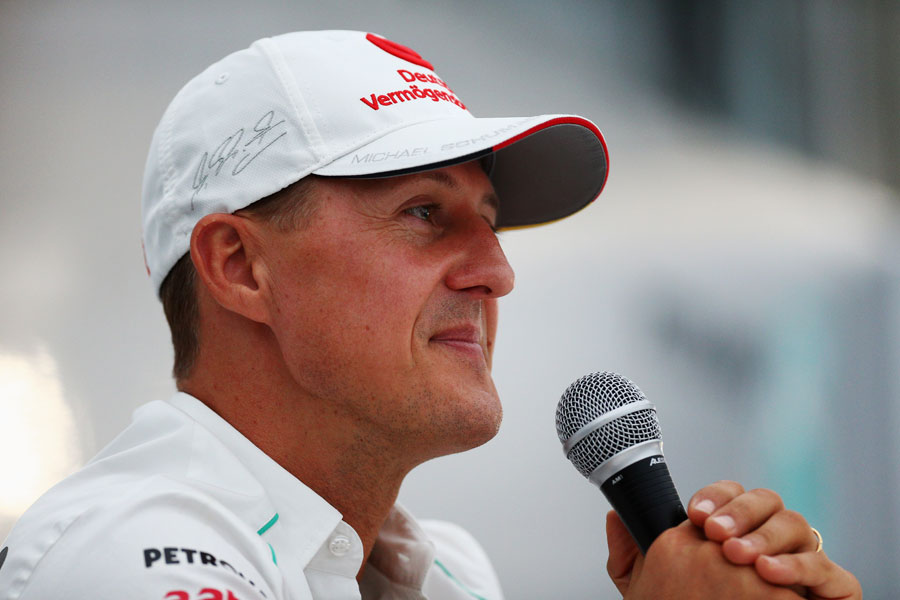 Michael Schumacher faces questions after announcing his second retirement to the press