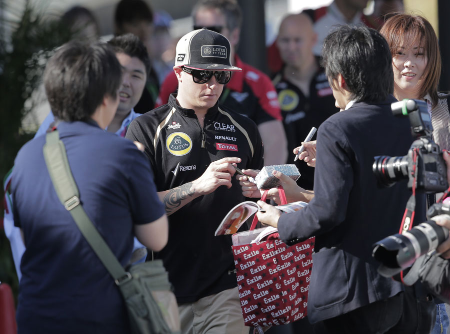 Kimi Raikkonen arrives at the circuit on Friday morning