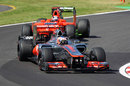 Jenson Button leads Timo Glock on track